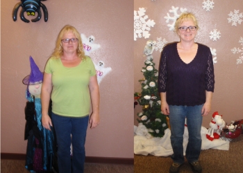 A woman in green shirt and black top standing next to christmas tree.